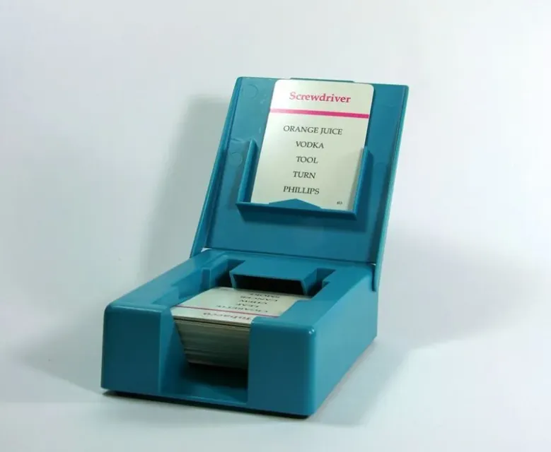 Taboo card holder loaded with a sample card reading Screwdriver and its five forbidden words.